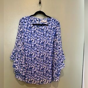 Gorgeous,  lined and flowing blouse with fluted sleeves.